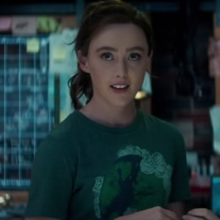 Kathryn Newton is wearing a green tee in the picture.